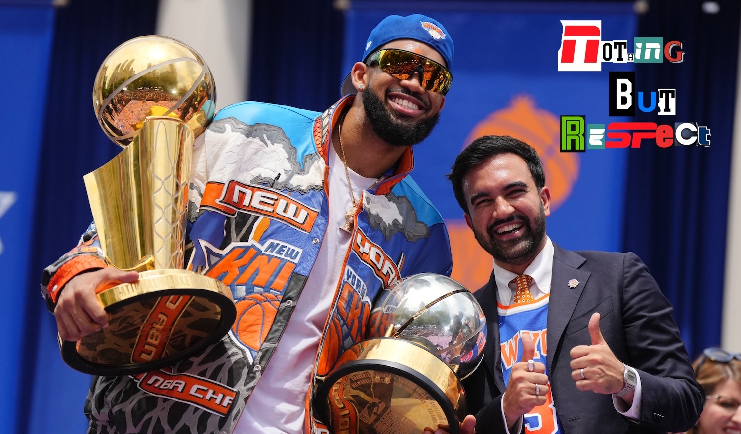 NEW YORK, NEW YORK - JUNE 18: Karl-Anthony Towns #32 of the New York Knicks and New York City Mayor Zohran Mamdani celebrate with the Larry O'Brien Championship Trophy and the Bob Cousy Trophy during the New York Knicks Championship ticker tape parade and victory rally celebrating winning the 2026 NBA Finals on June 18, 2026 in New York City. The New York Knicks defeated the San Antonio Spurs in five games to win their first NBA Championship in 53 years. (Photo by Angelina Katsanis/Getty Images)