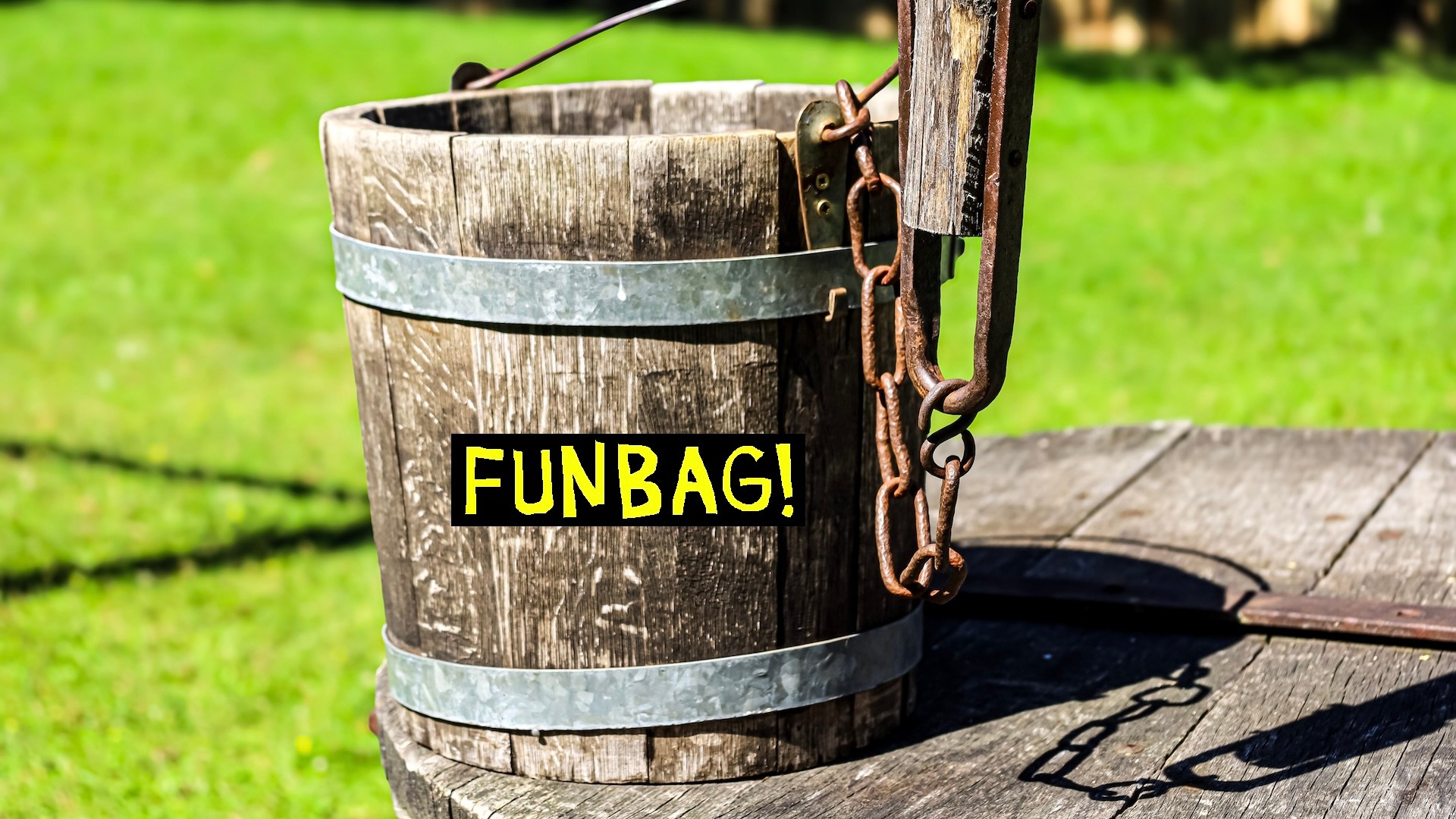 A wooden bucket with the funbag logo on it