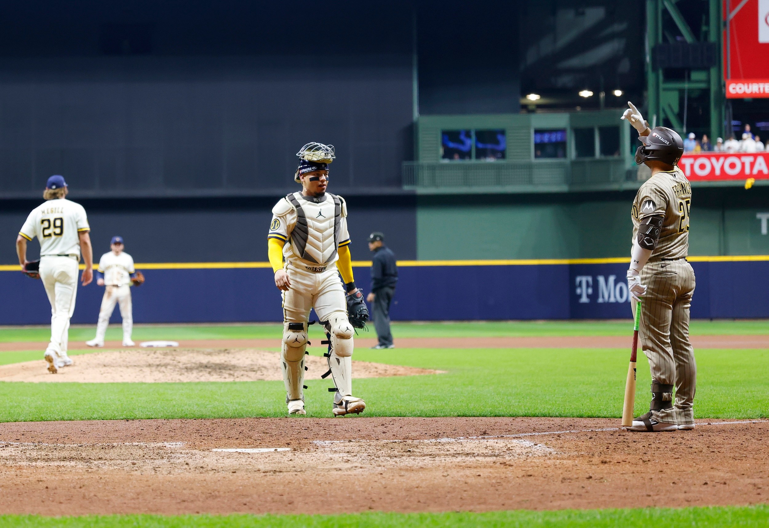 Ty France gestures at the ceiling after his fly ball is caught.