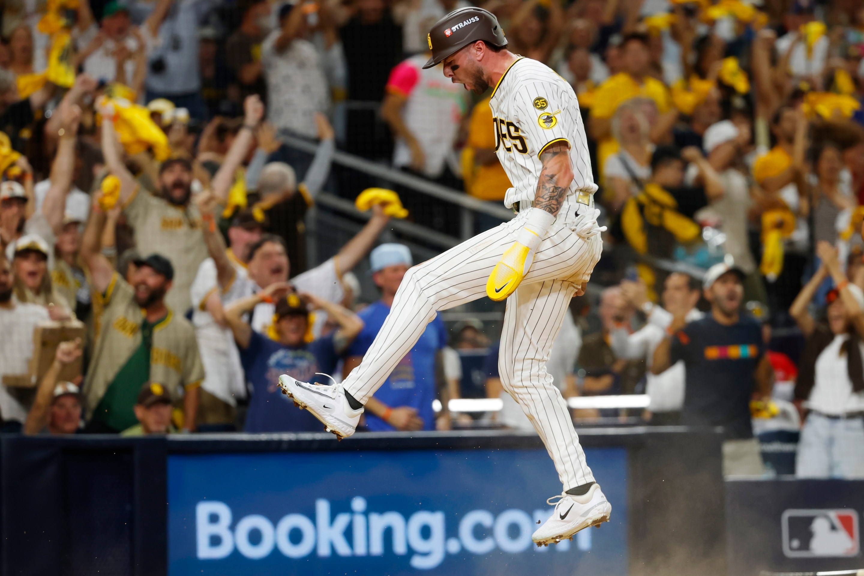 Jackson Merrill #3 of the San Diego Padres celebrates after scoring in the third inning against the Milwaukee Brewers during game three of the National League Division Series in San Diego on October 6, 2026.