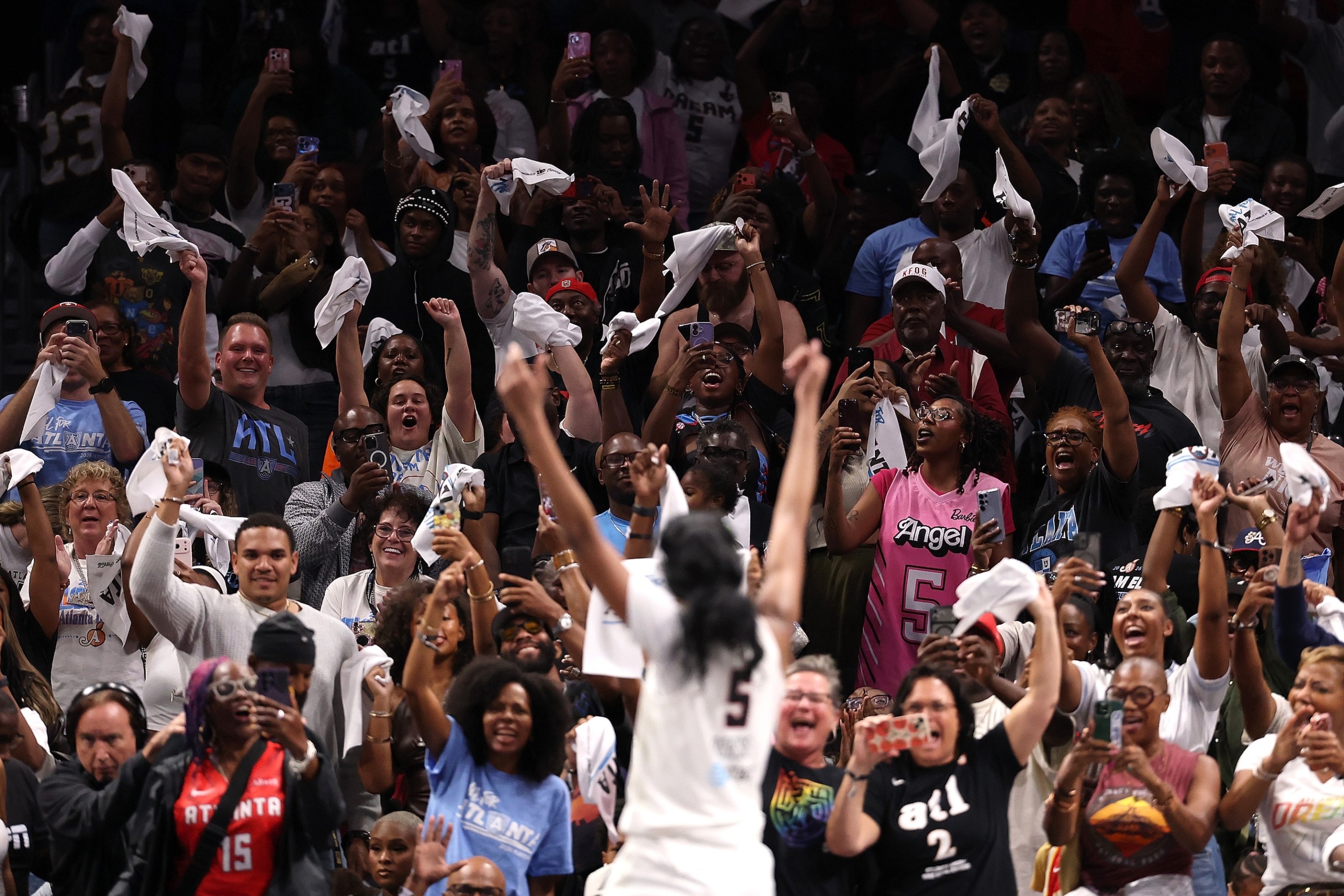 Fans react to Angel Reese #5 of the Atlanta Dream celebrating in the final seconds of their 92-82 win over the New York Liberty in game one of the semifinals of the WNBA playoffs at State Farm Arena on October 04, 2026 in Atlanta, Georgia.