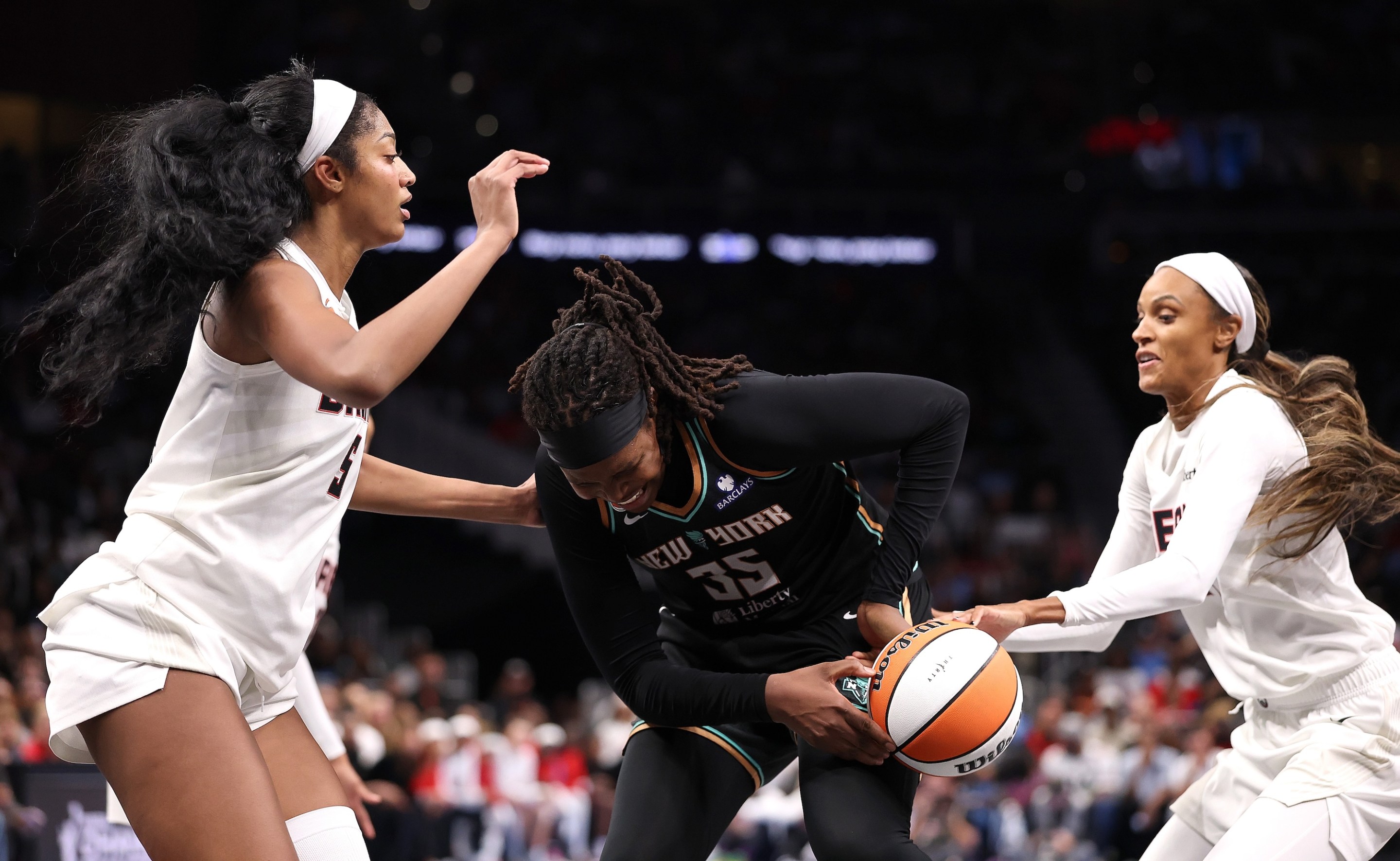 Angel Reese #5 defends as DeWanna Bonner #24 of the Atlanta Dream steals the ball from Jonquel Jones #35 of the New York Liberty during the fourth quarter of game one of the semifinals of the WNBA playoffs at State Farm Arena on October 04, 2026 in Atlanta, Georgia.