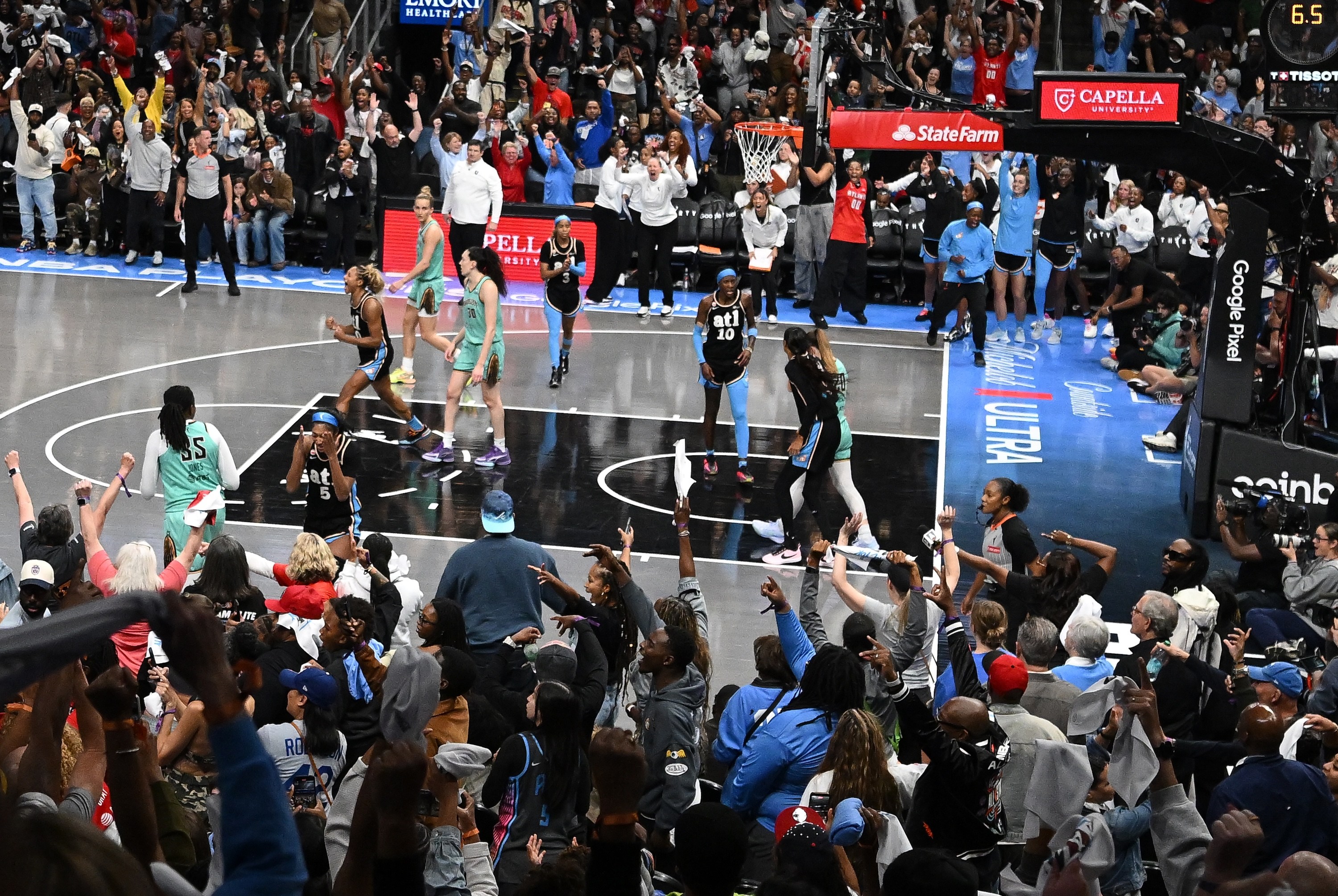 The Atlanta Dream celebrate a 101-98 win over the New York Liberty during overtime of game two of the semifinals of the WNBA playoffs at State Farm Arena on October 7, 2026 in Atlanta, Georgia. NOTE TO USER: User expressly acknowledges and agrees that, by downloading and or using this photograph, User is consenting to the terms and conditions of the Getty Images License Agreement.