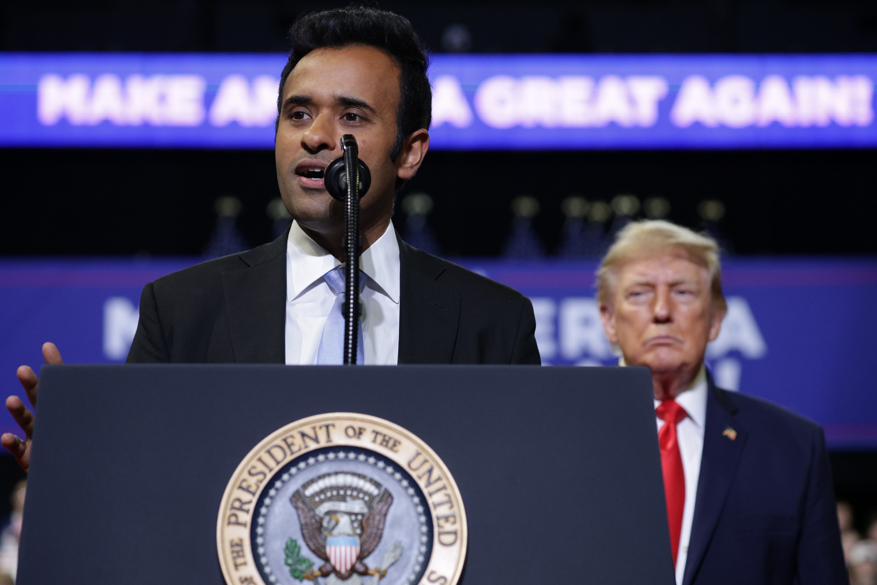 Ohio Republican gubernatorial candidate Vivek Ramaswamy speaks during a rally with U.S. President Donald Trump at the Covelli Centre on October 12, 2026 in Youngstown, Ohio. Trump's kind of looming in the background here.