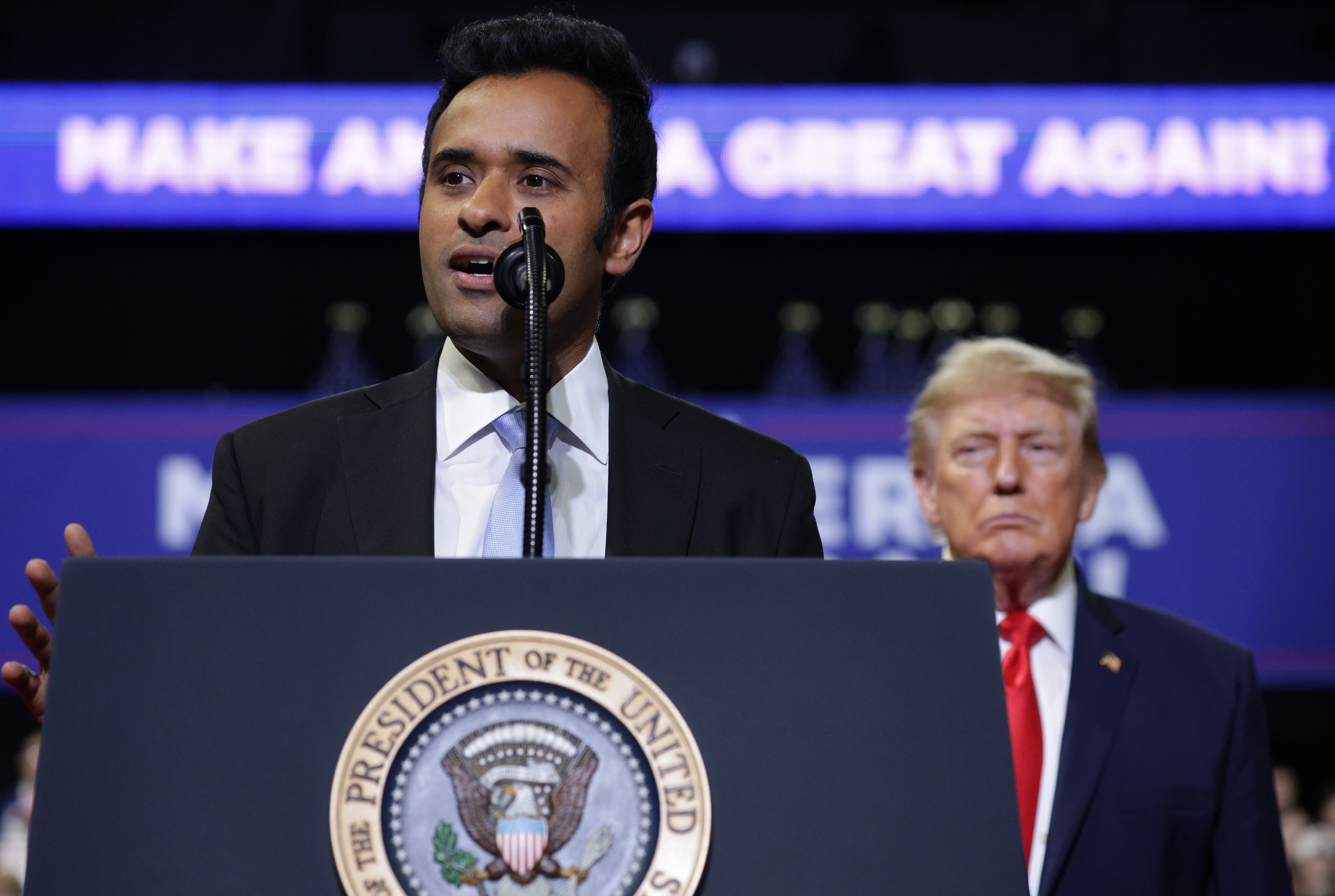 Ohio Republican gubernatorial candidate Vivek Ramaswamy speaks during a rally with U.S. President Donald Trump at the Covelli Centre on October 12, 2026 in Youngstown, Ohio. Trump's kind of looming in the background here.