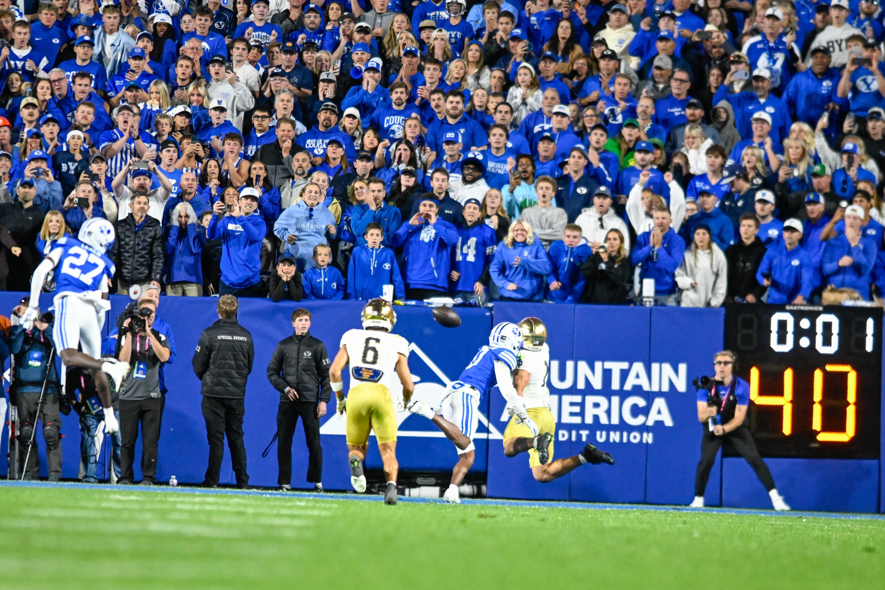 BYU fans watch with anticipation on the last play of the game to see an incomplete pass from Notre Dame