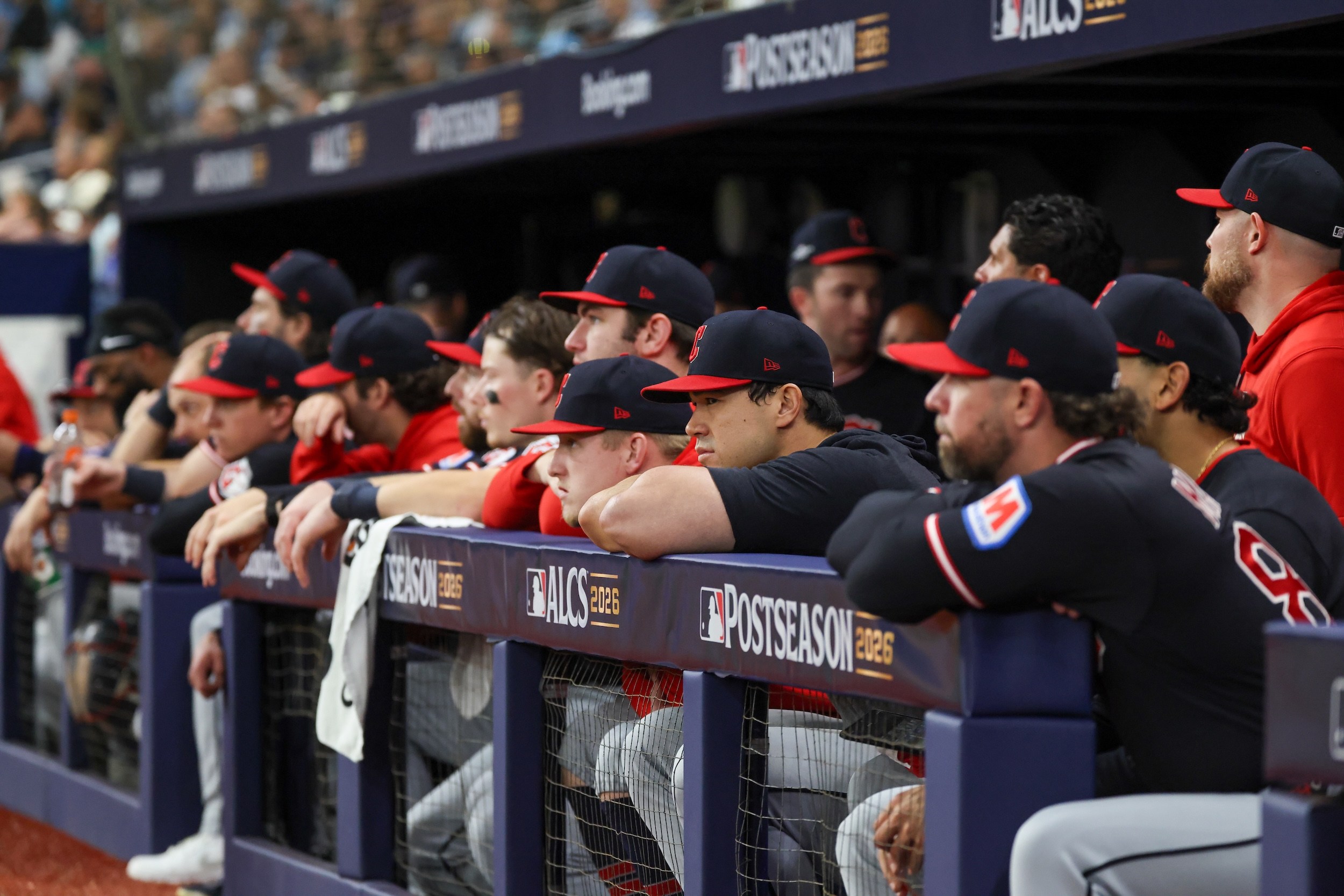 Members of the Cleveland Guardians look on from the dugout during Game Six of the American League Championship Series.