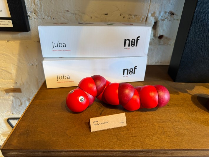 a red wooden caterpillar called Juba that costs $85