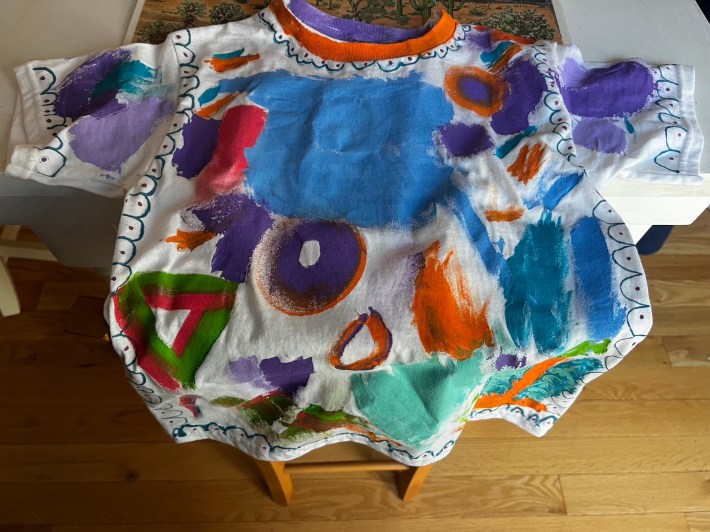 A colorful t-shirt, painted by a five-year-old.