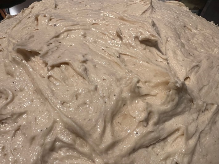 A close view of the surface of the icing, where it is starting to warm and separate in the middle.