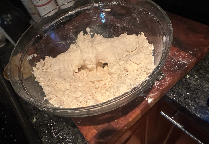 Dough in a glass bowl