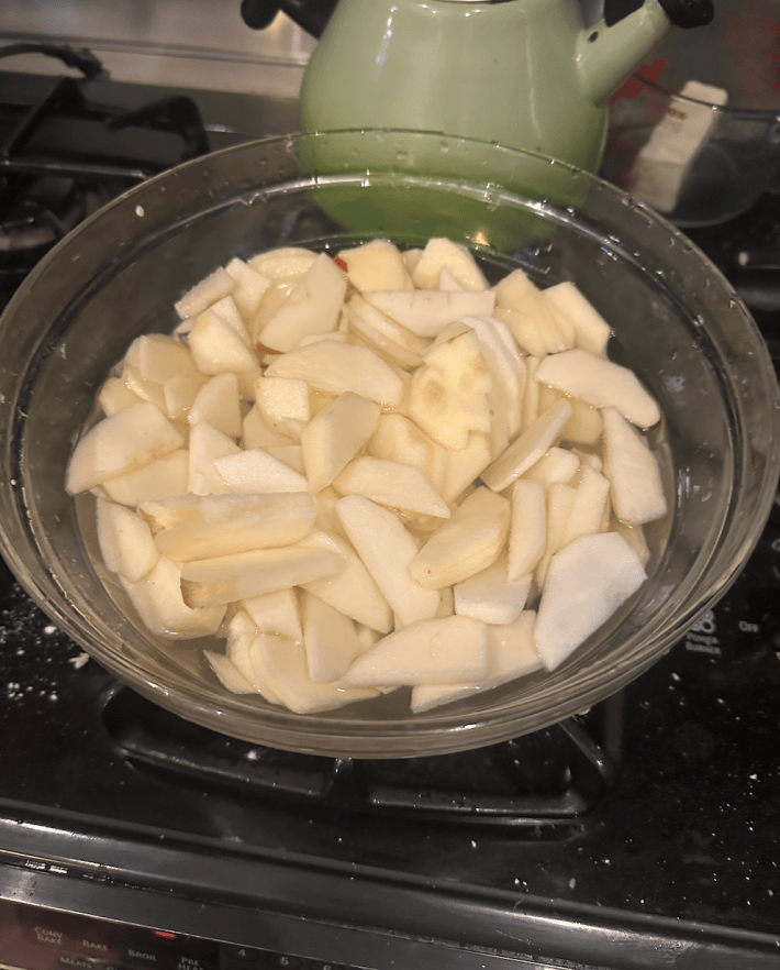 Apples in a bowl of Sprite