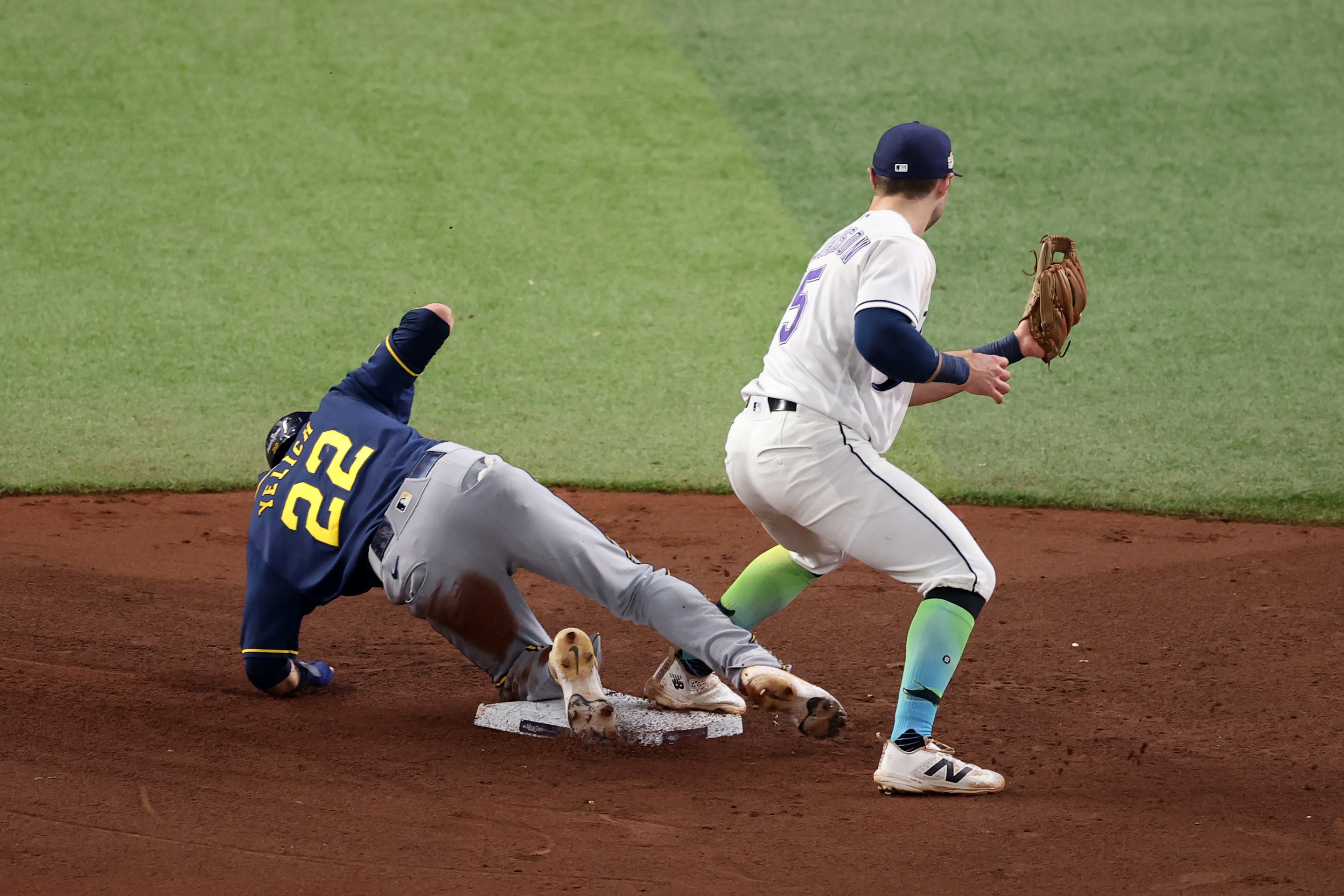 Christian Yelich #22 of the Milwaukee Brewers is safe at second base.