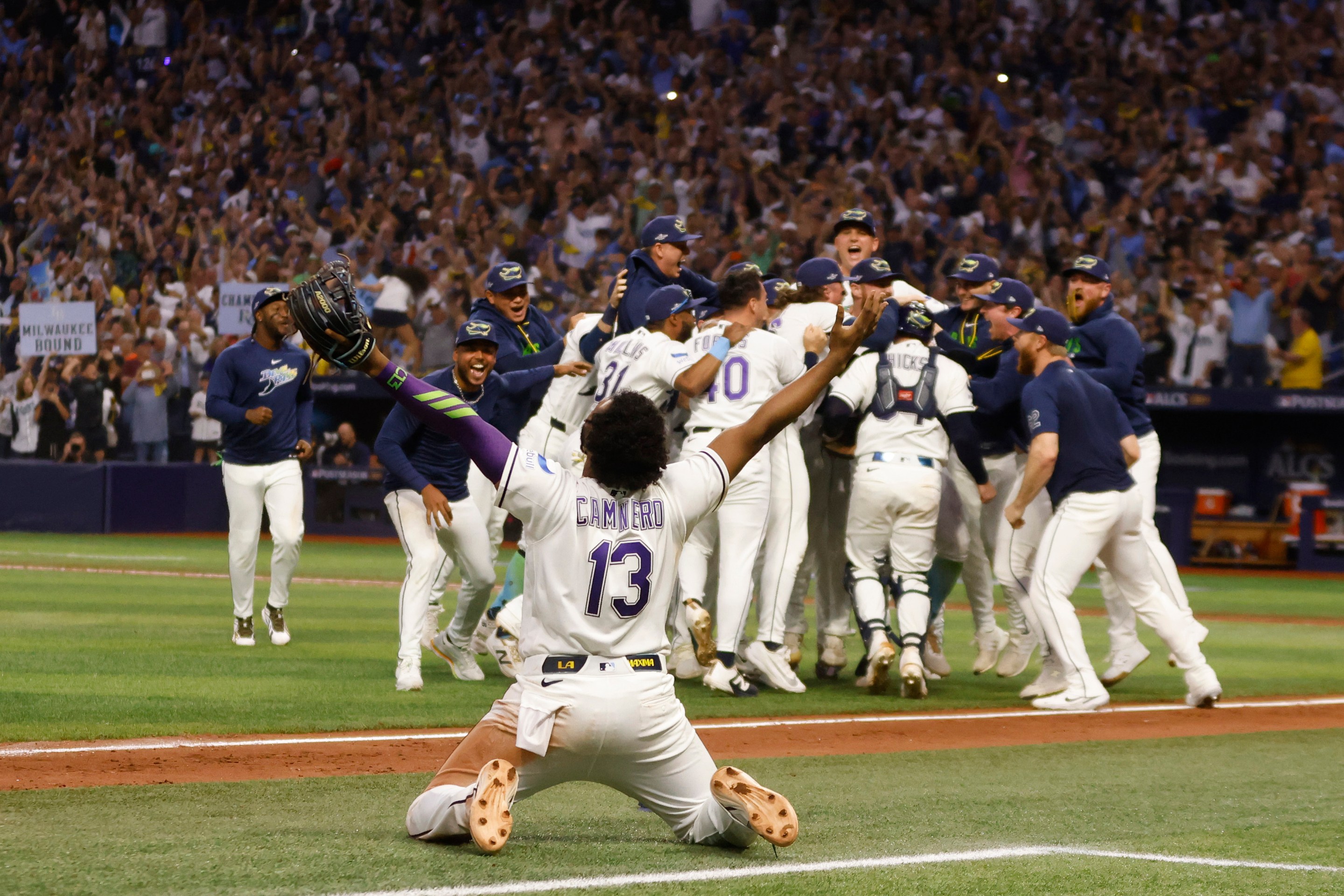 Junior Caminero #13 of the Tampa Bay Rays celebrates after defeating the Cleveland Guardians in game six of the American League Championship Series