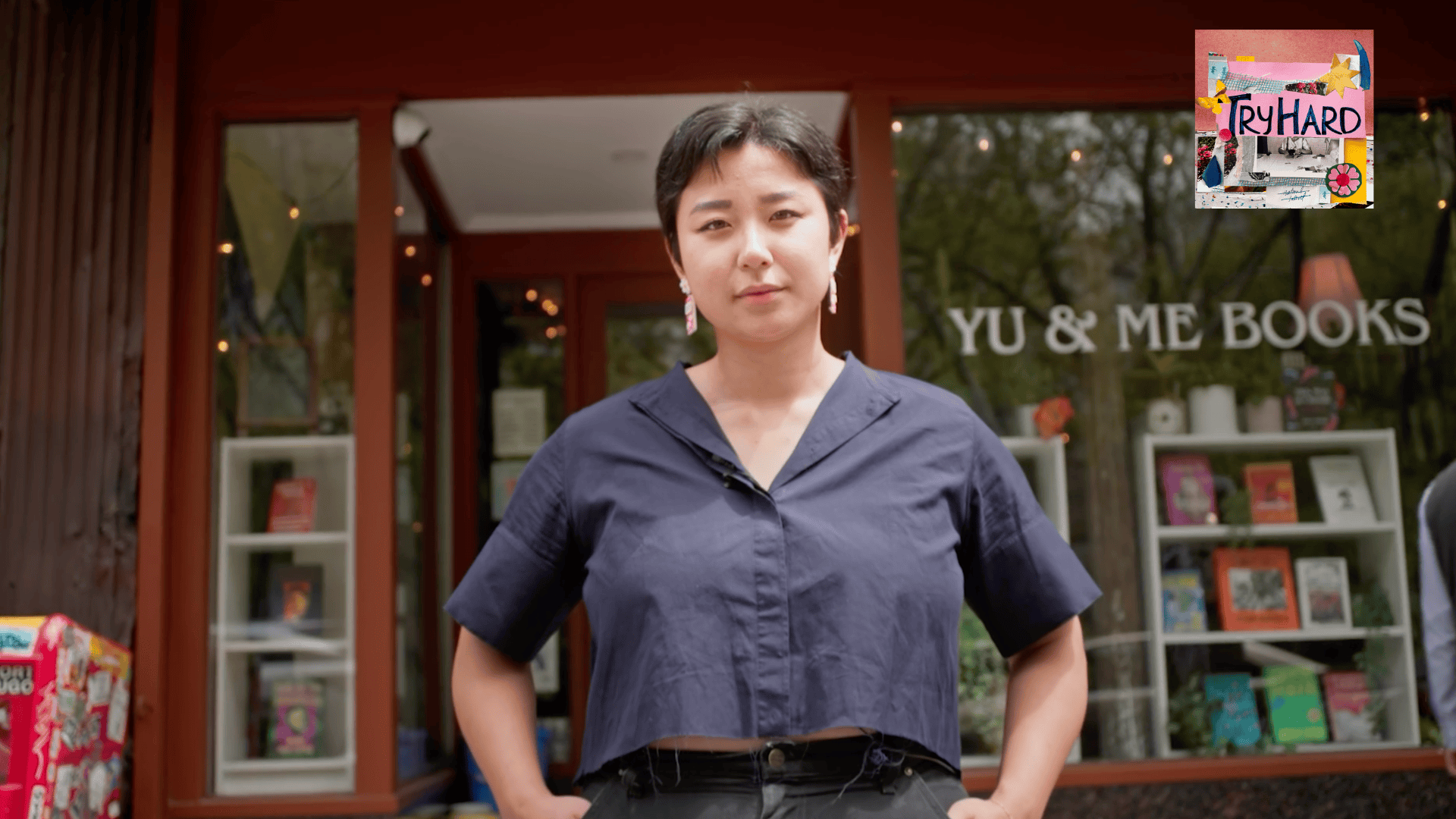 Lucy Yu stands in front of her bookstore, Yu & Me Books