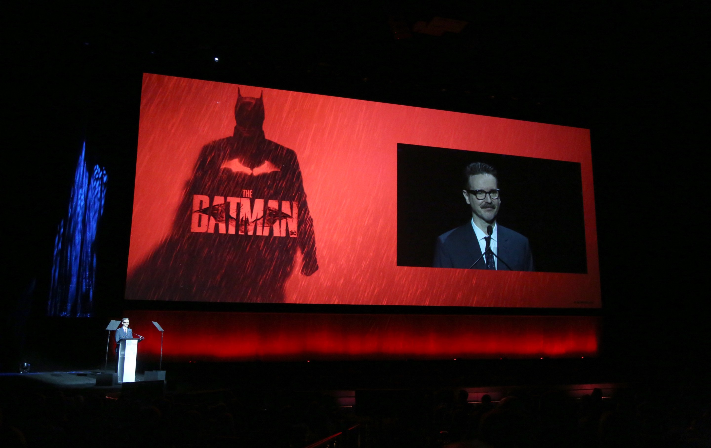 Director Matt Reeves speaks with the logo from his movie "The Batman" in the background during the “The State of the Industry” and Neon Studio presentation.