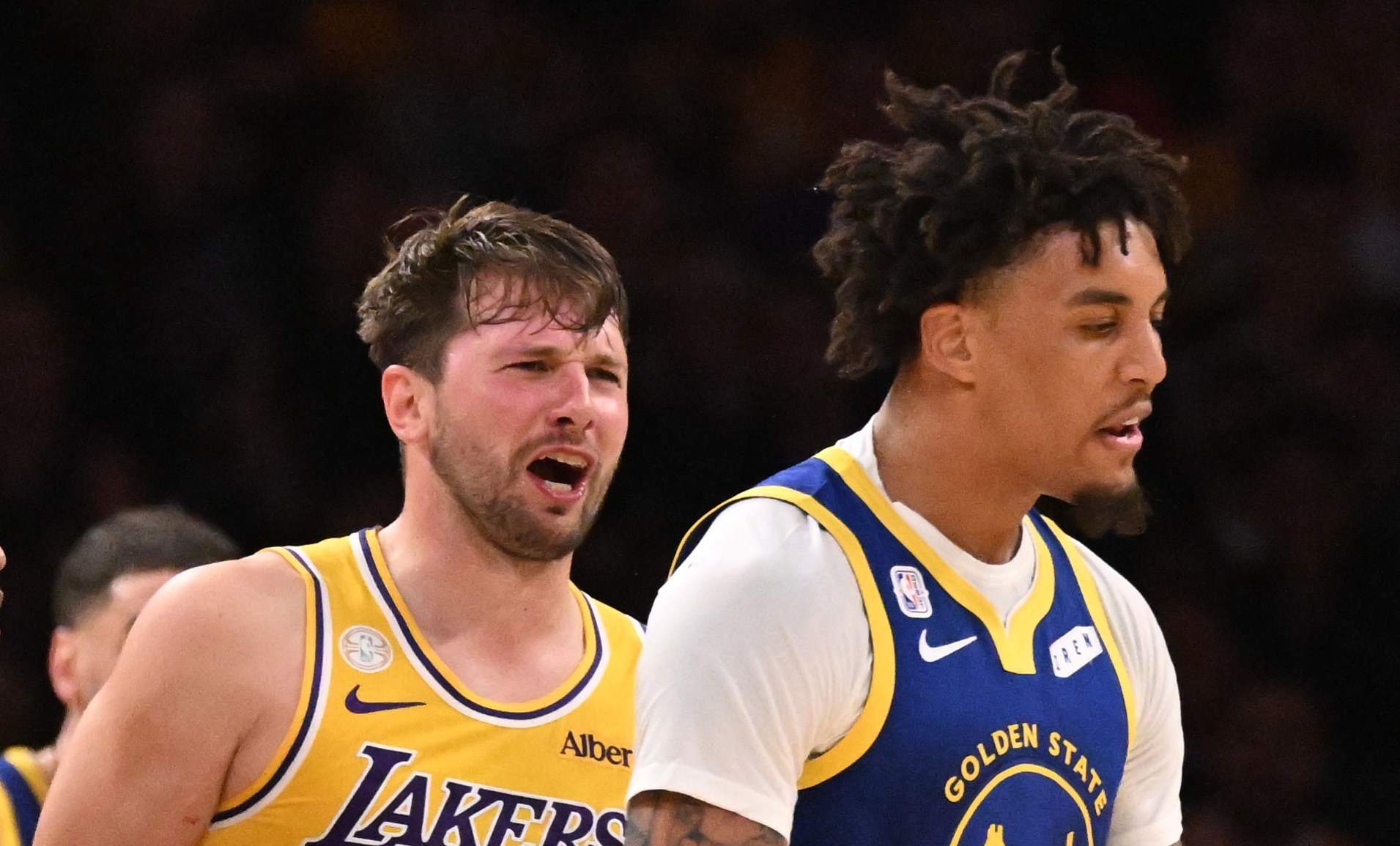 Guard Luka Doncic #77 of the Los Angeles Lakers reqacts after a foul by forward Yaxel Lendeborg #1 of the Golden State Warriors as guard Brandon Williams #12 of the Golden State Warriors tries seperate in the first half of a NBA playoff basketball game at Crypto.com Arena in Los Angeles on Wednesday, October 21, 2026. (Photo by Keith Birmingham/MediaNews Group/Pasadena Star-News via Getty Images)